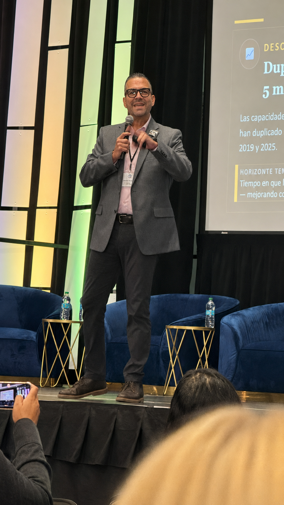 Nesty Delgado delivering a keynote on stage